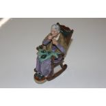 A Royal Doulton figure "A Stitch In Time"