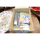 A box of various gaming related books etc.