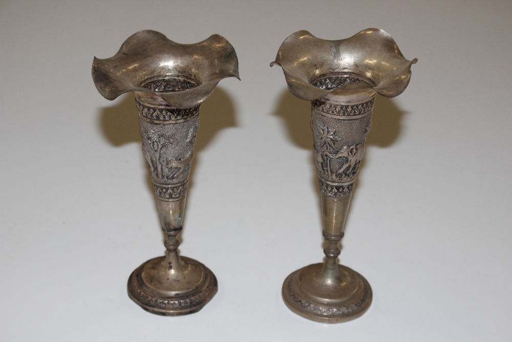 A pair of Indian white metal trumpet shaped vases