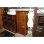 An oak two door storage cupboard