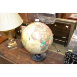 A World globe lamp on stand