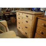 A stripped pine chest fitted four long drawers