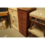 A stained pine chest fitted six drawers