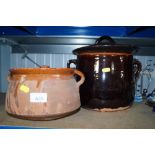 Two pottery cooking pots with lids