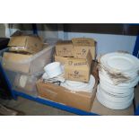 A large collection of white glazed dinnerware