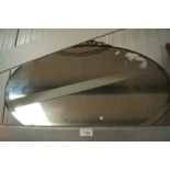 An oval framed and bevelled edge wall mirror