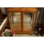 A teak display cabinet