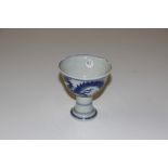 A Chinese blue and white dragon decorated stem cup