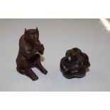 A Netsuke in the form of a seated man and a monkey