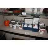 Six Royal Worcester egg coddlers and an orange pot