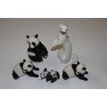 A collection of USSR porcelain pandas and a meerka