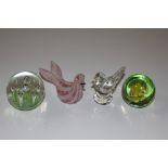 Four glass paperweights, two in the form of birds