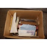 A box of various stamp albums, ephemera etc.