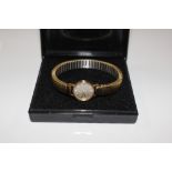 A ladies Tissot gold cased wrist watch