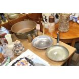 A copper and brass preserve pan, frying pan, and t