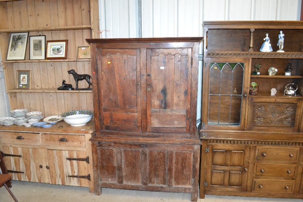 An antique oak press cupboard