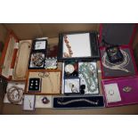 A box containing various boxed costume jewellery e