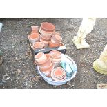 A box and enamel container of various flower pots