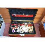 A box containing various costume jewellery