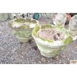 A pair of concrete garden planters