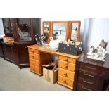 A modern pine twin pedestal dressing table with mi