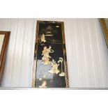 An Oriental black lacquered panel