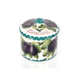 A Wemyss biscuit jar and cover decorated plums and leaves, retailed by T. Goode & Co. South Audley