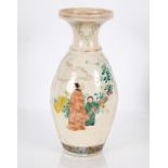 A Japanese pottery baluster vase, decorated with figures in exotic garden settings, scrolling