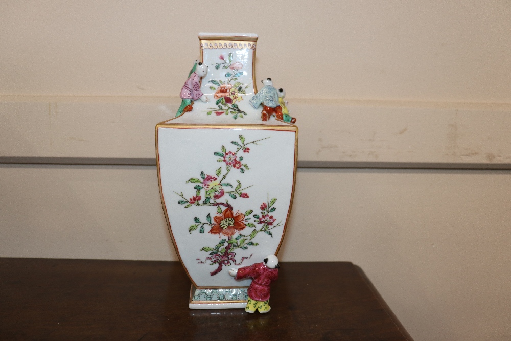 An unusual porcelain vase, painted in famille rose enamels and figures of boys applied to its - Image 10 of 15