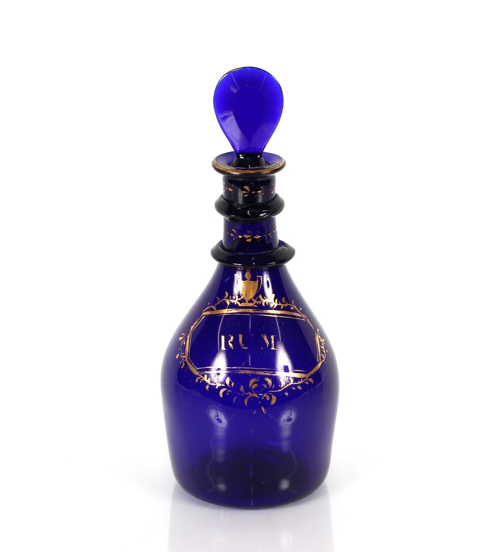 An early 19th Century Bristol blue glass rum decanter with pear shaped stopper, 24.5cm high