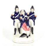 A rare 19th Century Staffordshire pottery figure, depicting The Death of Lord Nelson, 20cm high