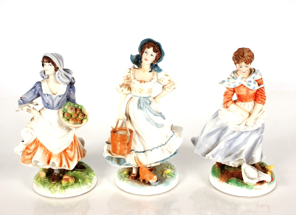 A Royal Worcester Old Country Ways figure "Rosie Picking Apples"; another "Farmers Wife"; and