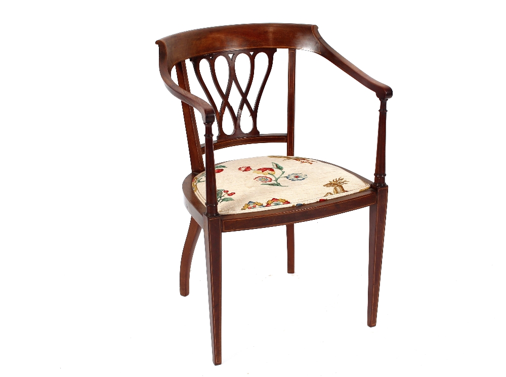 An Edwardian inlaid mahogany tub shaped chair, pierced splat back, floral embroidered upholstered