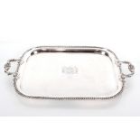 A large electroplated presentation tray, having acanthus and shell scroll handles, gadrooned border,