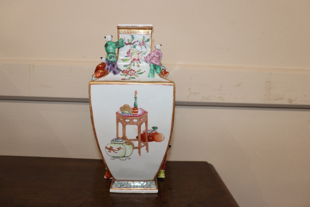 An unusual porcelain vase, painted in famille rose enamels and figures of boys applied to its - Image 9 of 15