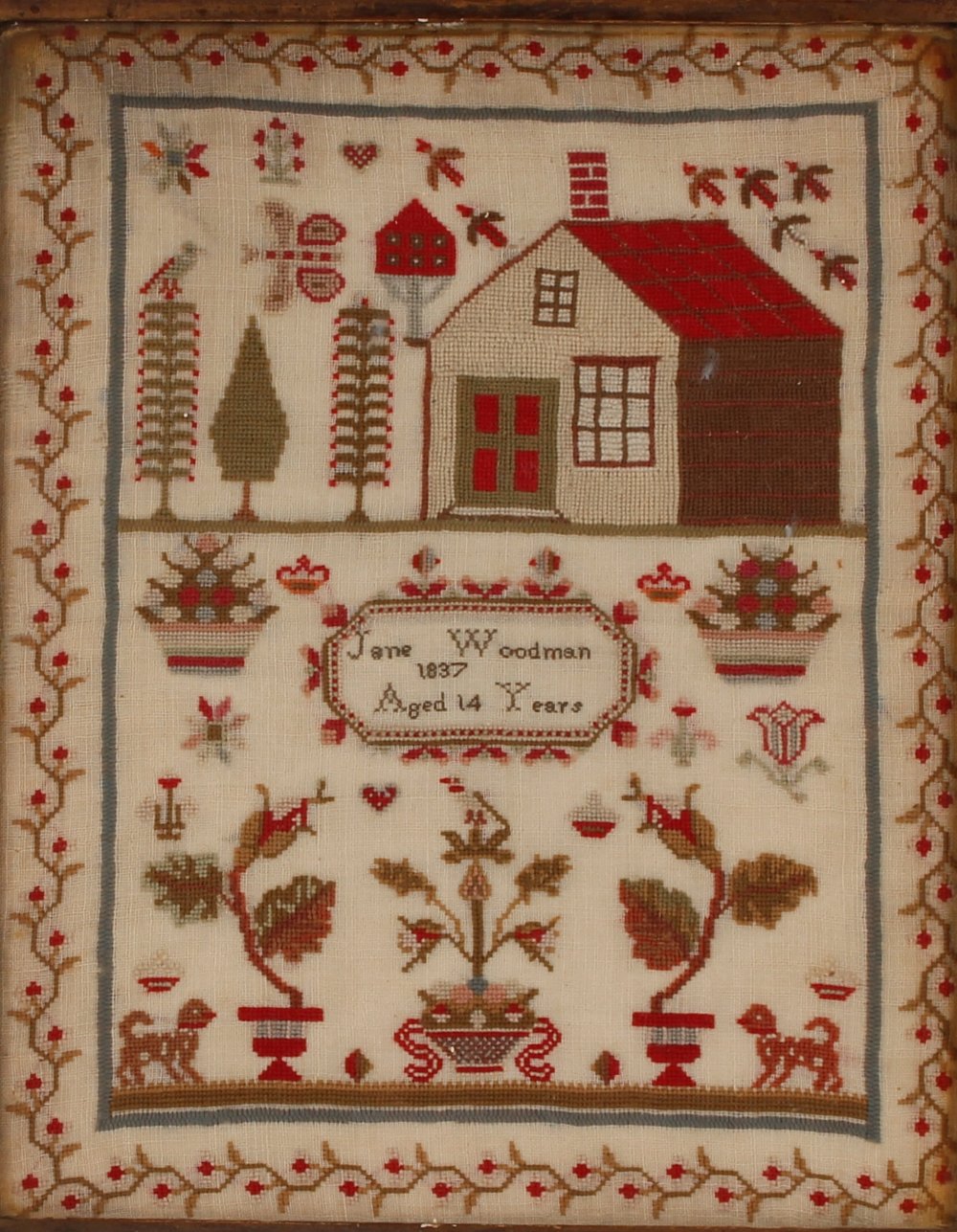 A Victorian sampler, worked by Jane Woodman Aged 14 Years, 1837, decorated with a house, trees