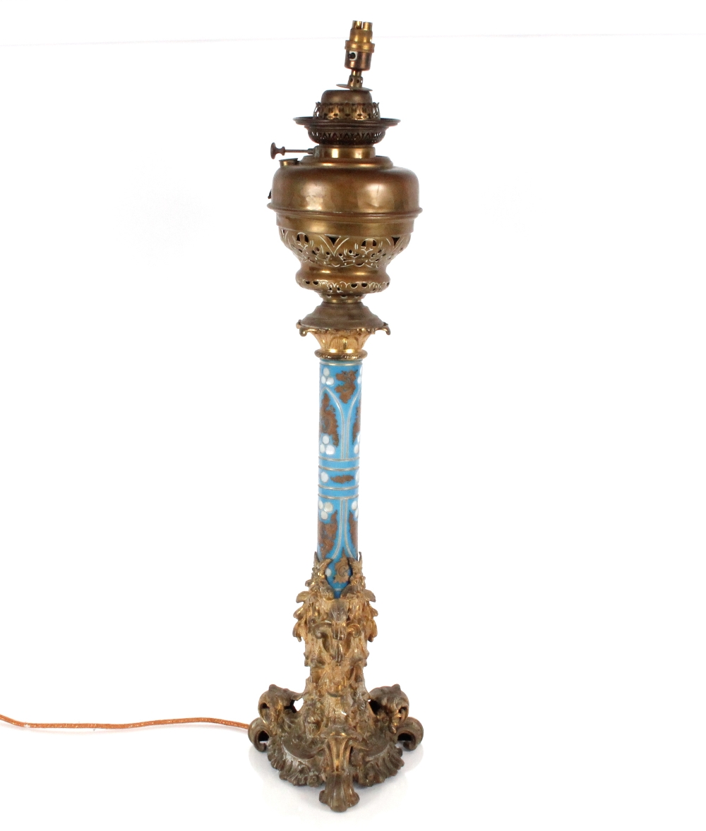 Victorian blue opaque glass and brass mounted oil lamp of large proportions with Rococo style base