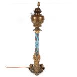 Victorian blue opaque glass and brass mounted oil lamp of large proportions with Rococo style base
