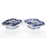 A pair of 19th Century Chinese pedestal dishes of oval shape decorated river scenes with mountains