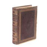 A leather and brass bound Henry & Scott Bible