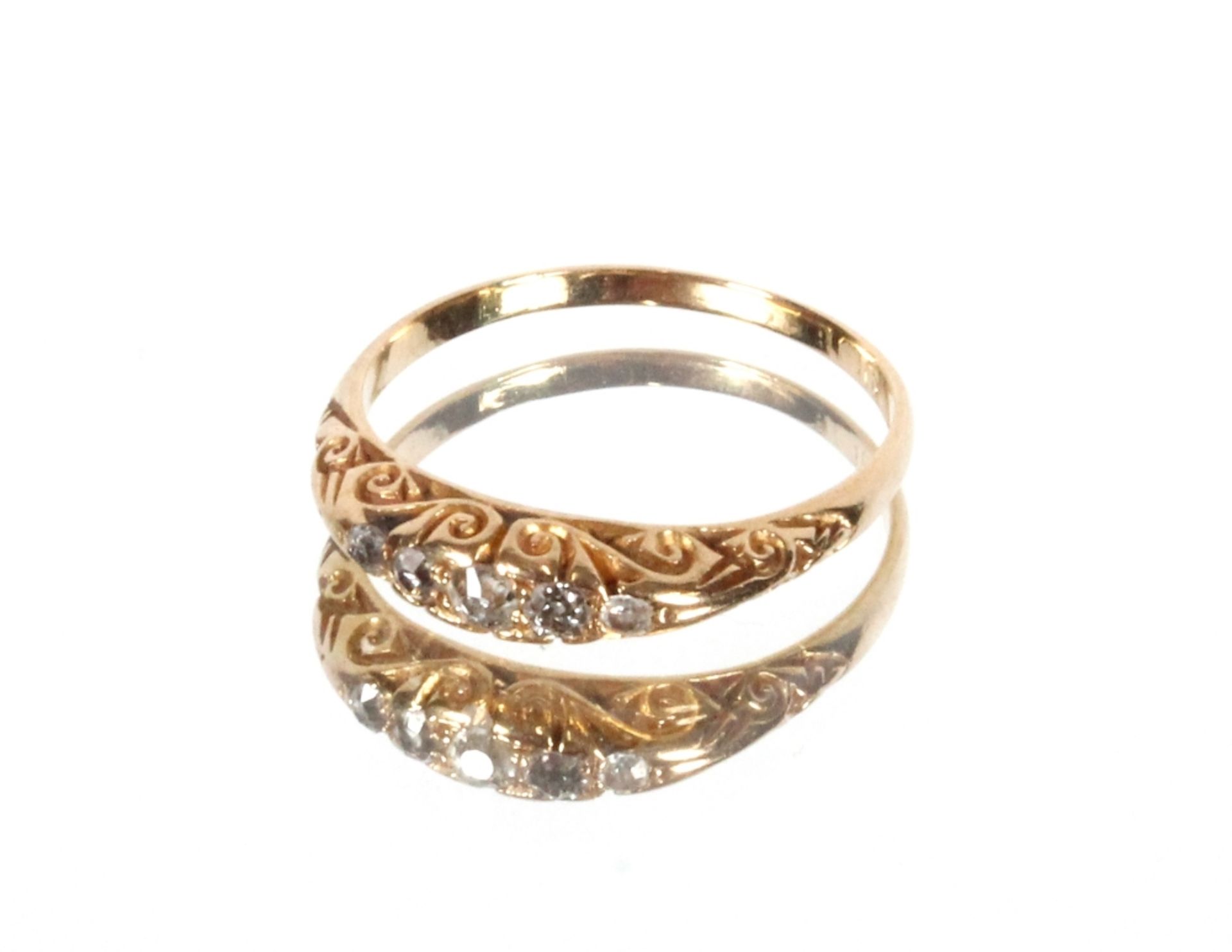 An 18ct gold ring set with five graduated old cut diamonds, Size Q/R, 2.7gms total weight