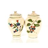 A pair of antique pottery olive jars with lids, bearing label "From The Collection Of Mona Bratt",