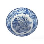 A 19th Century blue and white transfer printed bowl decorated rural scenes, 25.5.cm dia.