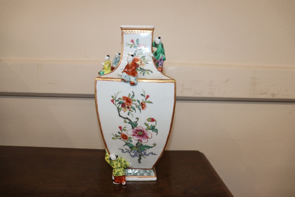 An unusual porcelain vase, painted in famille rose enamels and figures of boys applied to its - Image 8 of 15