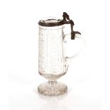 A heavy cut glass Stein with pewter mounts, hobnail pattern raised on a circular spread foot, 20cm