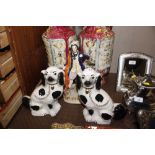 A pair of Staffordshire style spaniels; and a Staf