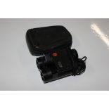 A pair of Leica 3 x 20 binoculars and case