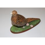 A pottery figure of a game bird