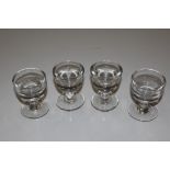 Four antique glass penny lick / toastmaster glasse