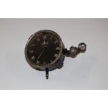 A vintage car clock